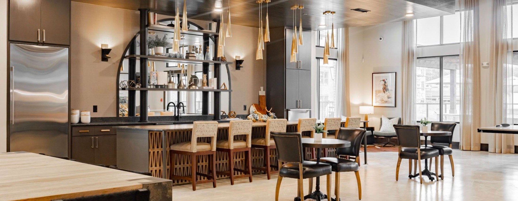a large kitchen with tables and chairs and an island